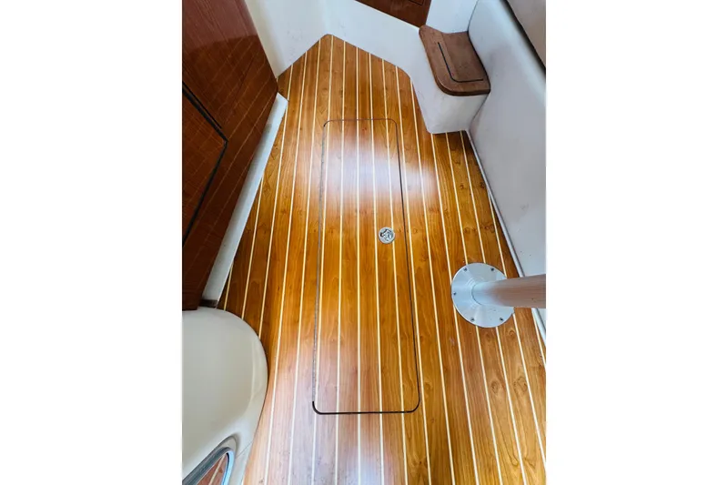 Slide: The Image of 2006 Regal 3360 Window Express interior with polished wooden flooring and seating area. - 57