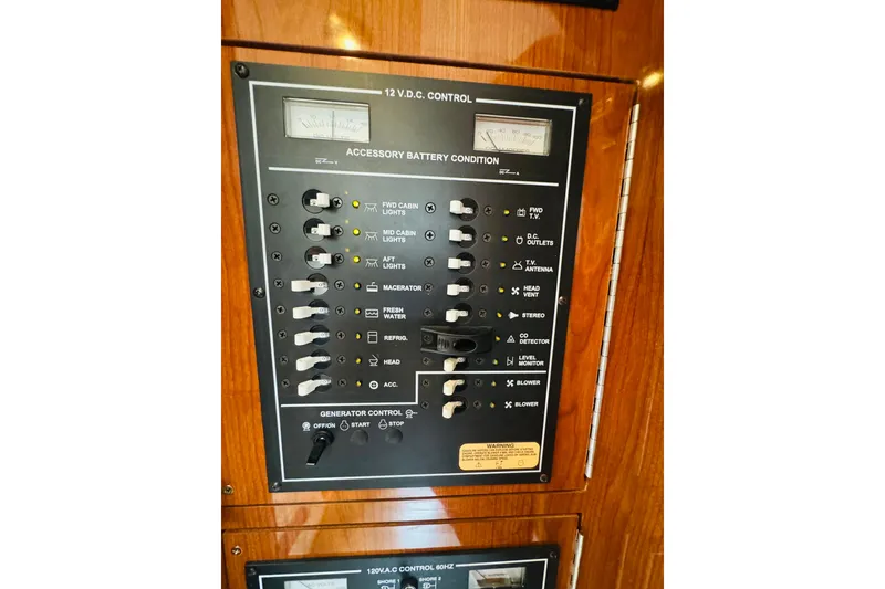 Slide: The Image of Control panel of a 2006 Regal 3360 Window Express boat, showing accessory battery condition. - 60