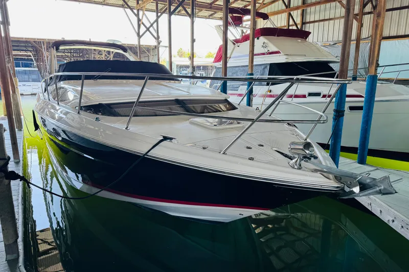 Slide: The Image of 2006 Regal 3360 Window Express boat docked in a marina, side view. - 8