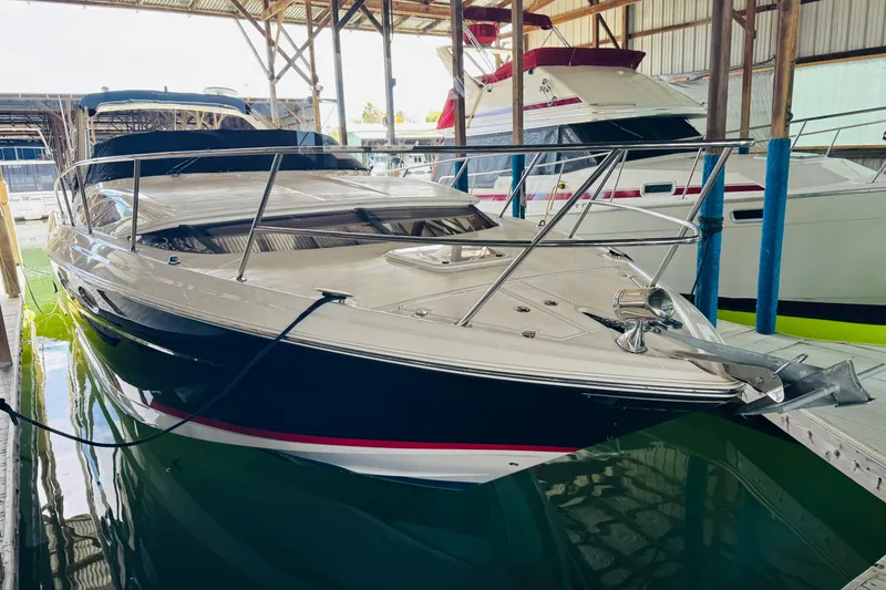 Slide: The Image of 2006 Regal 3360 Window Express boat docked in a marina, side view. - 9