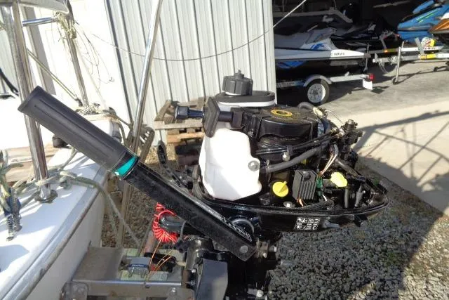 Slide: The Image of Outboard motor on a 2007 Sanibel by International Marine 18 Pocket Cruiser. - 10