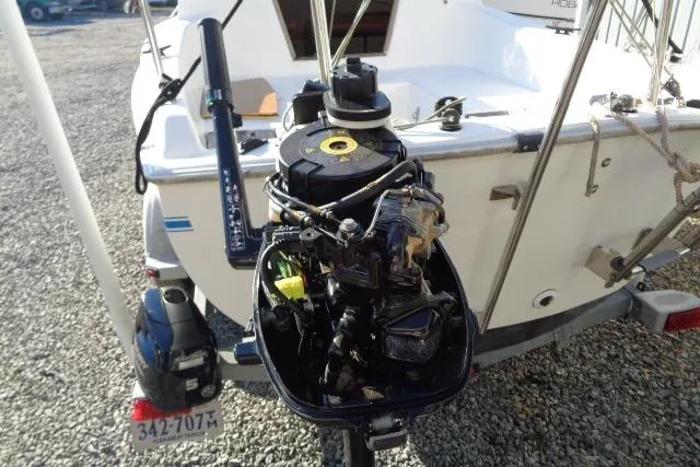 Slide: The Image of 2007 Sanibel by International Marine 18 Pocket Cruiser with outboard motor, rear view. - 11