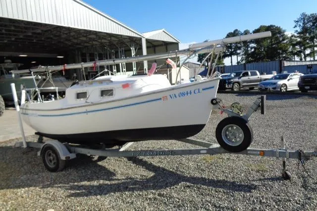 Slide: The Image of 2007 Sanibel by International Marine 18 Pocket Cruiser on trailer, parked outdoors. - 3