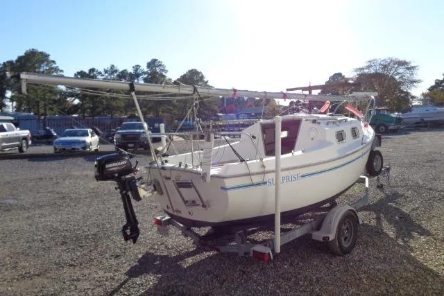 Slide: The Image of 2007 Sanibel by International Marine 18 Pocket Cruiser on trailer in a parking lot. - 9