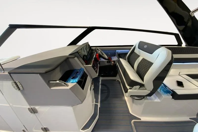 Slide: The Image of Interior of 2026 Cobalt R35 boat with modern seating and sleek dashboard design. - 14