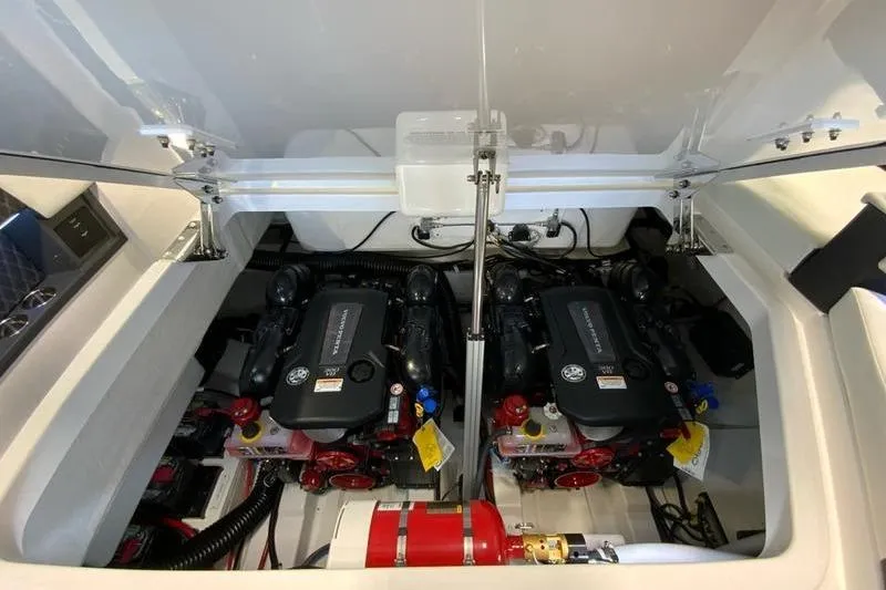 Slide: The Image of Engine compartment of a 2026 Cobalt R35 boat, showcasing dual engines and mechanical components. - 17