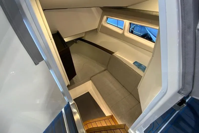 Slide: The Image of Interior cabin of 2026 Cobalt R35 boat with seating and windows. - 21
