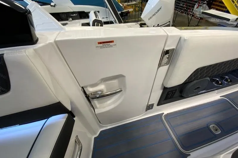 Slide: The Image of 2026 Cobalt R35 boat interior with sleek white door and modern design elements. - 25