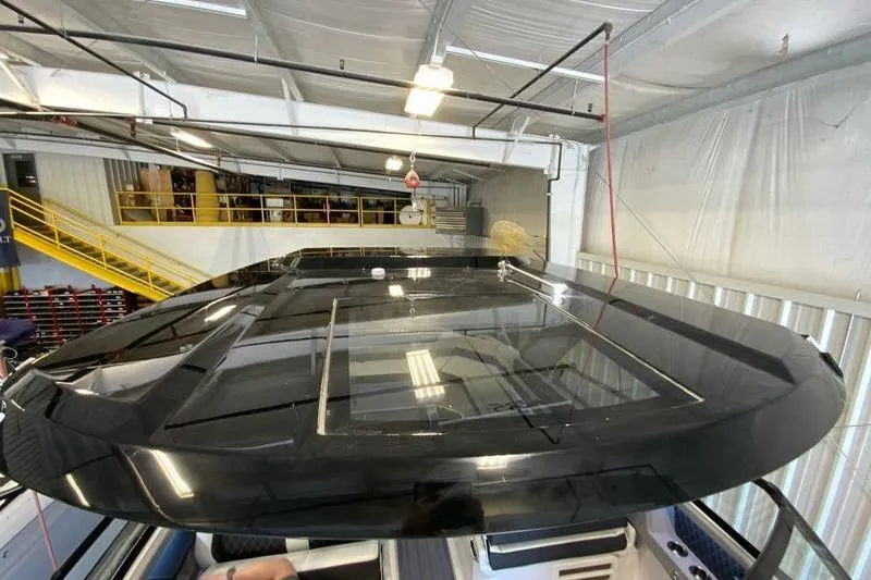 Slide: The Image of 2026 Cobalt R35 boat roof in a well-lit indoor facility. - 26