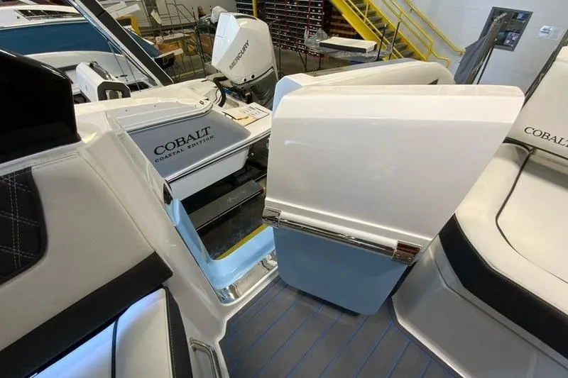 Slide: The Image of 2026 Cobalt R35 boat interior with open storage compartment and seating. - 27