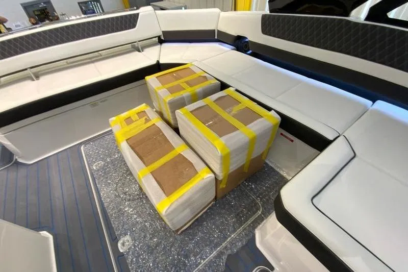 Slide: The Image of Interior of 2026 Cobalt R35 boat with packages on the floor. - 31