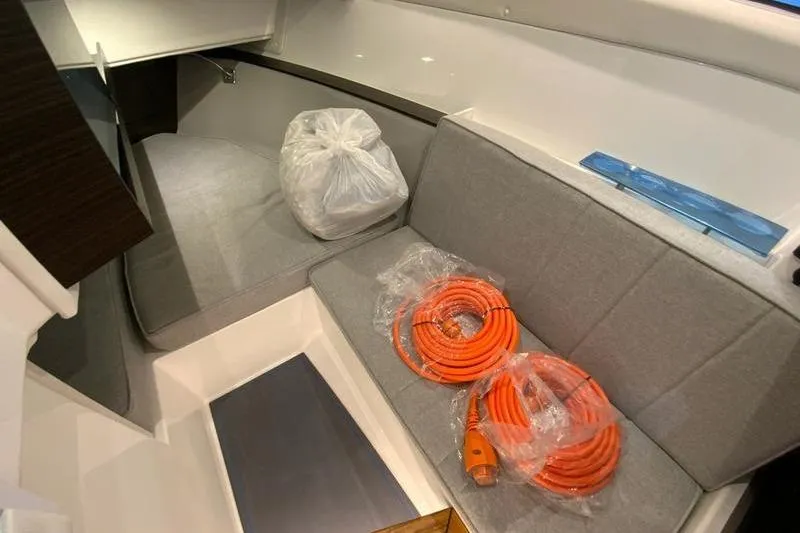 Slide: The Image of Interior of 2026 Cobalt R35 boat with gray seating and orange cables. - 33