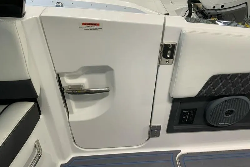 Slide: The Image of 2026 Cobalt R35 boat interior door with sleek handle and speaker. - 36