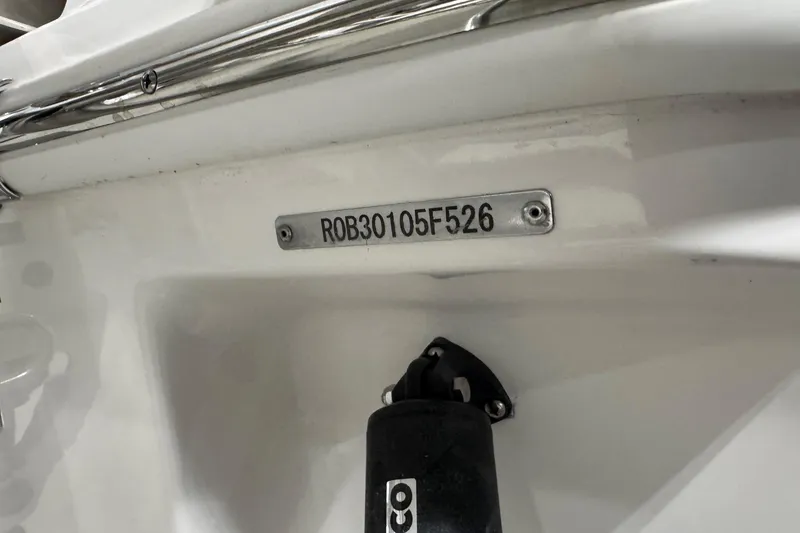 Slide: The Image of 2026 Robalo R257 Dual Console boat identification plate with serial number. - 14