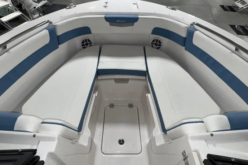 Slide: The Image of 2026 Robalo R257 Dual Console boat interior with blue and white seating. - 19