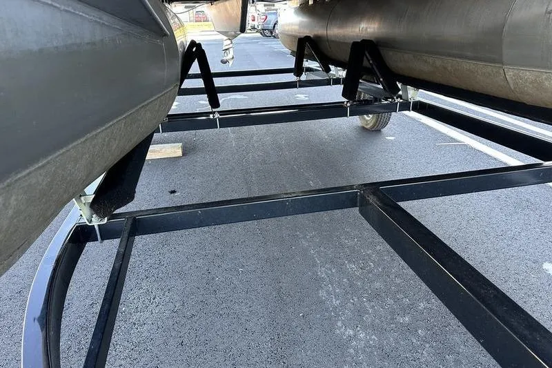 Slide: The Image of 2019 Starcraft EX 20 F4 boat trailer frame on asphalt surface. - 13