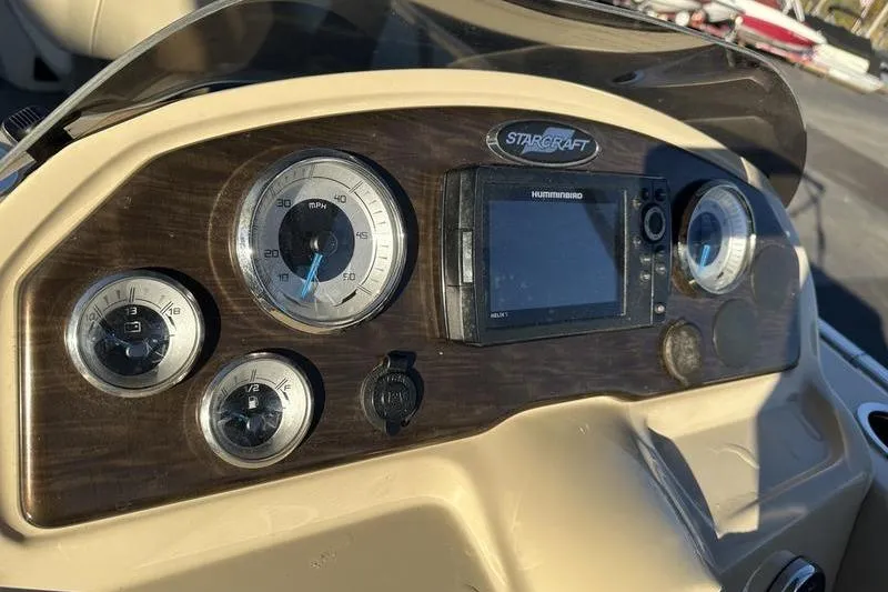Slide: The Image of Dashboard of 2019 Starcraft EX 20 F4 boat with gauges and navigation system. - 16