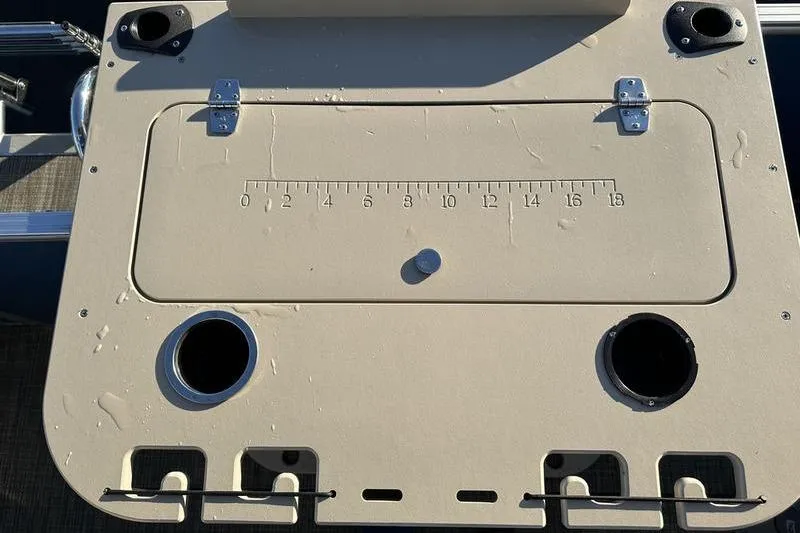 Slide: The Image of 2019 Starcraft EX 20 F4 boat deck with built-in ruler and cup holders. - 26