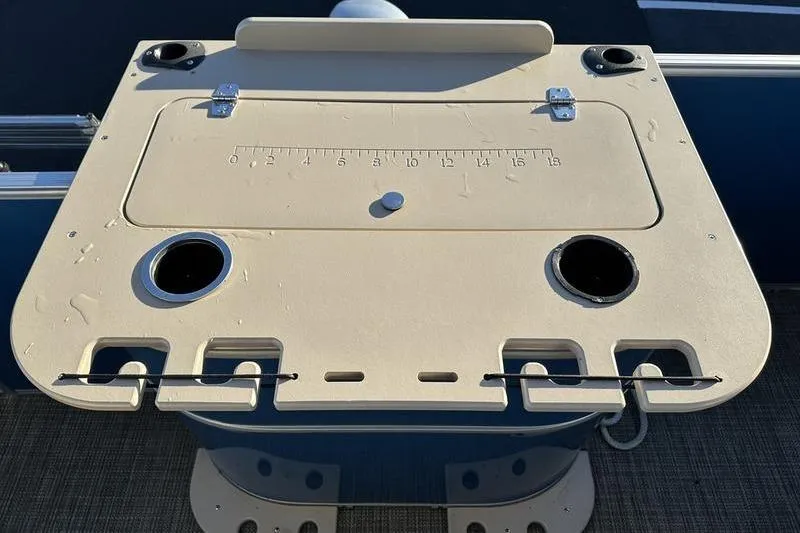 Slide: The Image of 2019 Starcraft EX 20 F4 boat table with cup holders and measuring guide. - 28