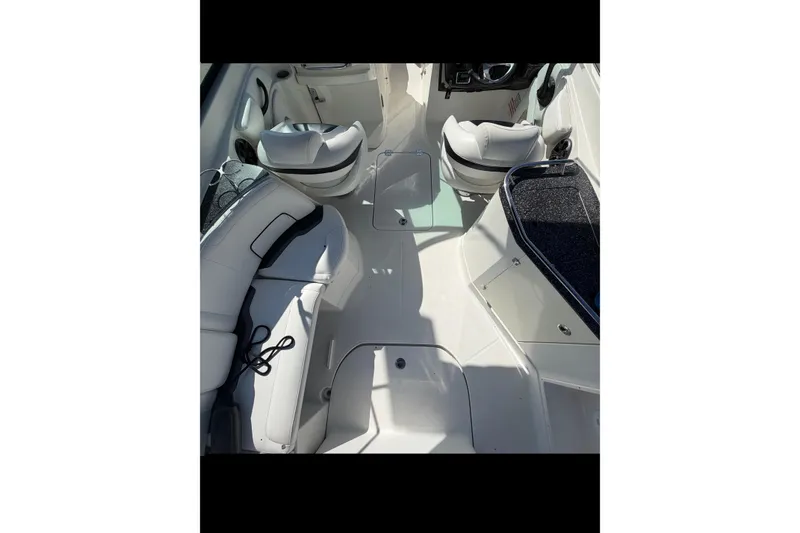 Slide: The Image of 2015 Monterey 264FS boat interior with white seating and sleek design. - 6