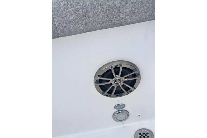 Slide: The Image of 2019 Sea Fox 226 Traveler boat interior with cushioned seating and storage. - 18