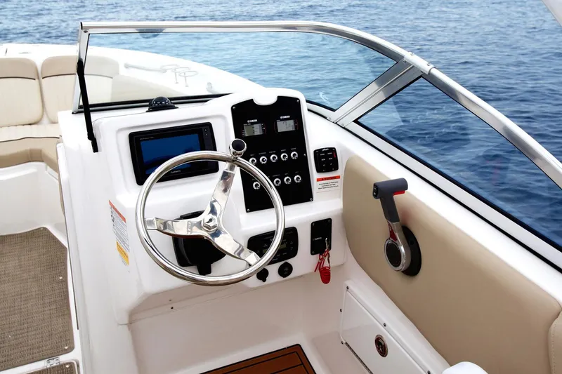 Slide: The Image of Manufacturer Provided Image: 2019 Sea Fox 226 Traveler boat interior with captain's chair and steering wheel. - 2