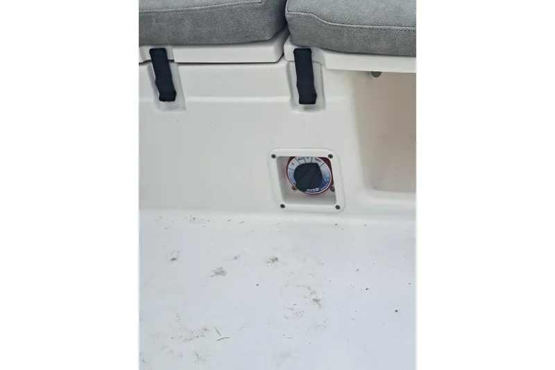 Slide: The Image of 2019 Sea Fox 226 Traveler boat seat with gray and white upholstery, outdoor setting. - 20
