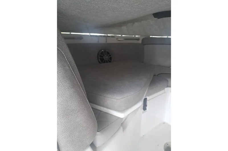 Slide: The Image of 2019 Sea Fox 226 Traveler boat interior cabin with cushioned seating. - 6
