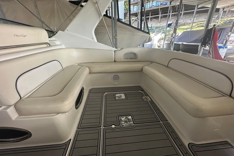 Slide: The Image of Interior of 2000 Chris-Craft 308 Express Cruiser with beige seating and sleek flooring. - 10