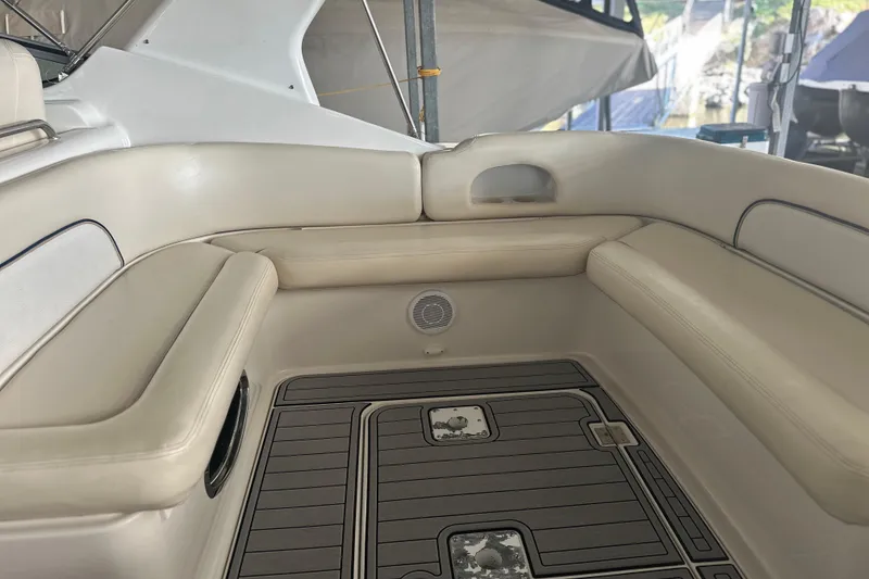 Slide: The Image of Interior of 2000 Chris-Craft 308 Express Cruiser with beige seating and teak flooring. - 11