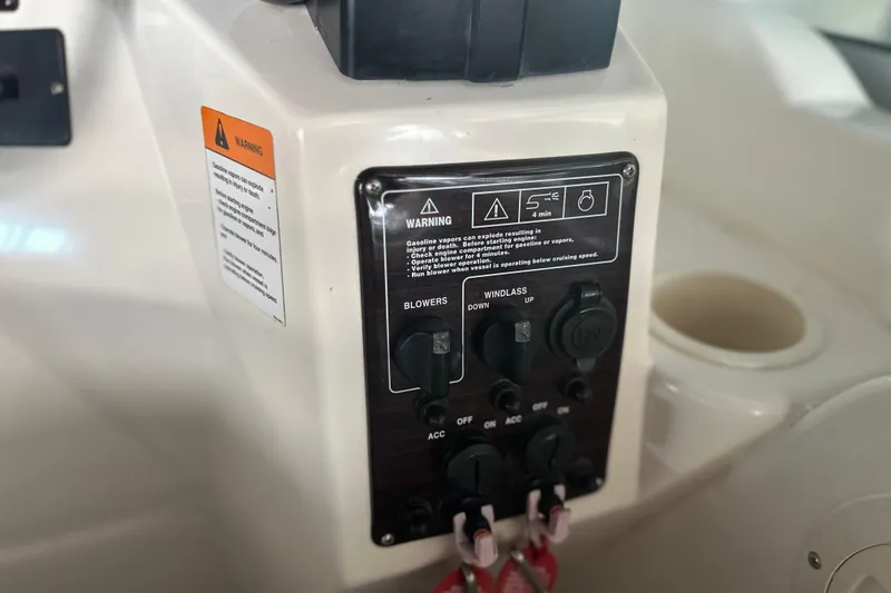 Slide: The Image of Control panel of a 2000 Chris-Craft 308 Express Cruiser with warning labels. - 26