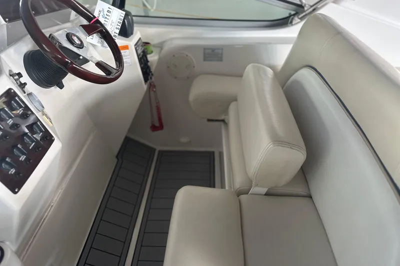 Slide: The Image of Interior of 2000 Chris-Craft 308 Express Cruiser with steering wheel and seating. - 33