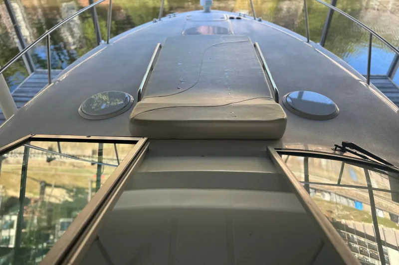 Slide: The Image of 2000 Chris-Craft 308 Express Cruiser deck view with open hatch and railing. - 38