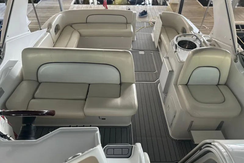Slide: The Image of 2000 Chris-Craft 308 Express Cruiser interior with beige seating and sleek design. - 41