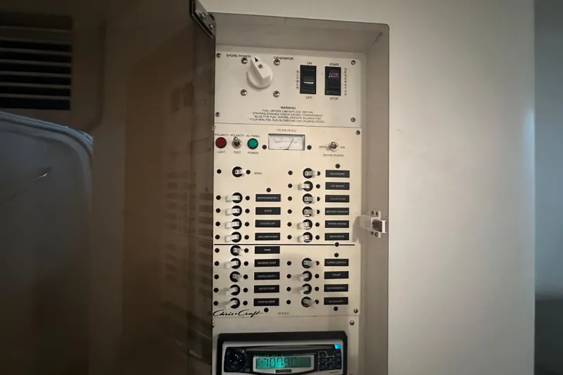 Slide: The Image of Electrical control panel of 2000 Chris-Craft 308 Express Cruiser boat. - 43