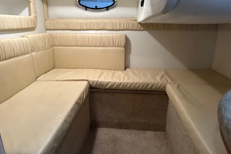 Slide: The Image of Interior of 2000 Chris-Craft 308 Express Cruiser with beige seating and carpeted floor. - 51
