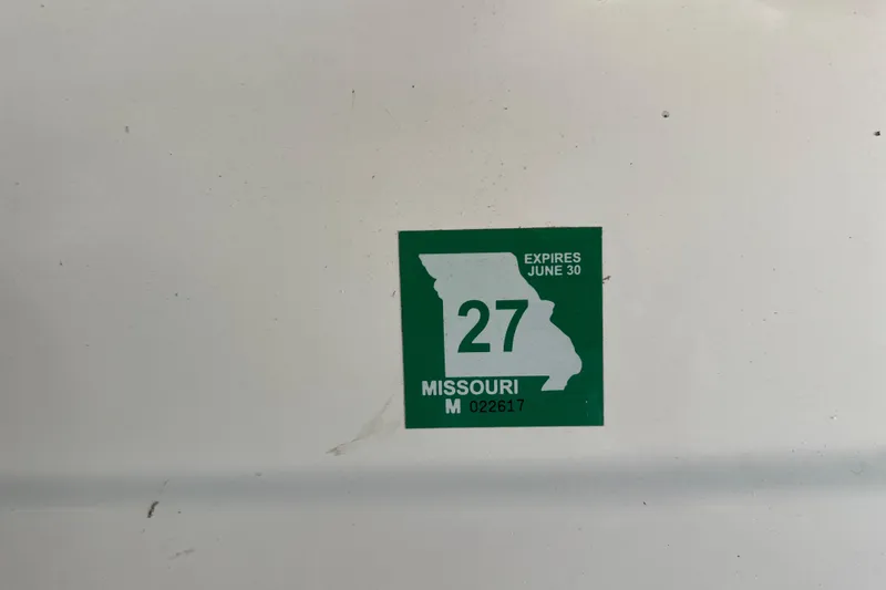 Slide: The Image of Missouri registration sticker on 2000 Chris-Craft 308 Express Cruiser, expires June 30. - 60