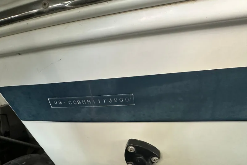 Slide: The Image of 2000 Chris-Craft 308 Express Cruiser hull identification number on boat exterior. - 61