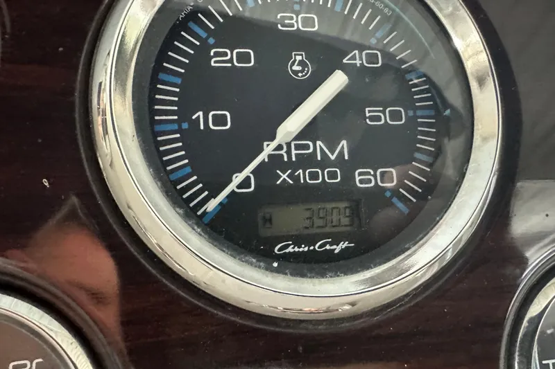 Slide: The Image of Close-up of a 2000 Chris-Craft 308 Express Cruiser RPM gauge. - 62