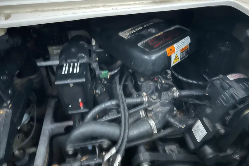Slide: The Image of Engine compartment of a 2000 Chris-Craft 308 Express Cruiser, featuring Volvo components. - 66