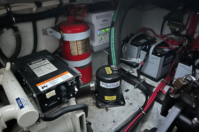 Slide: The Image of Engine room of 2000 Chris-Craft 308 Express Cruiser with batteries and fire extinguisher. - 67