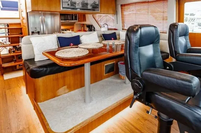 Slide: The Image of Luxurious interior of 2000 Pacific Mariner 65 Motoryacht with elegant seating and dining area. - 13