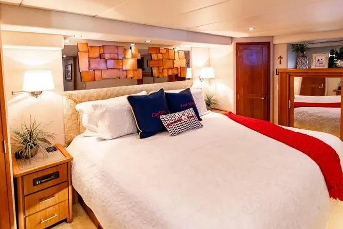 Slide: The Image of Luxurious bedroom in 2000 Pacific Mariner 65 Motoryacht with elegant decor and cozy bedding. - 14