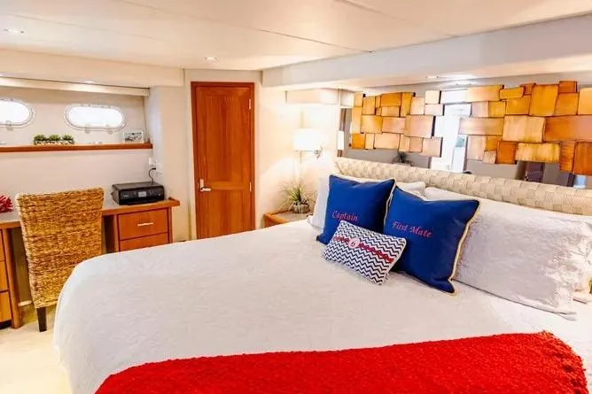 Slide: The Image of Luxurious bedroom in 2000 Pacific Mariner 65 Motoryacht with elegant decor and cozy bedding. - 15