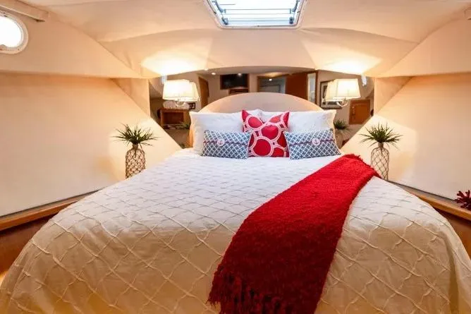 Slide: The Image of Luxurious bedroom interior of 2000 Pacific Mariner 65 Motoryacht with elegant bedding and decor. - 17
