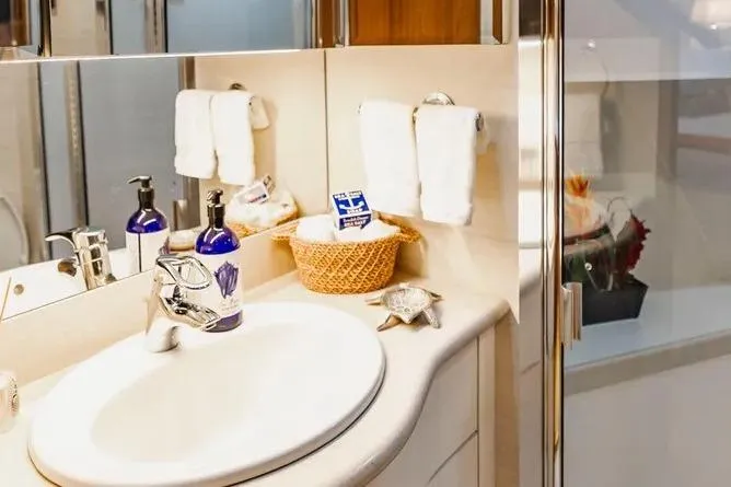 Slide: The Image of Luxurious bathroom in 2000 Pacific Mariner 65 Motoryacht with elegant sink and toiletries. - 19