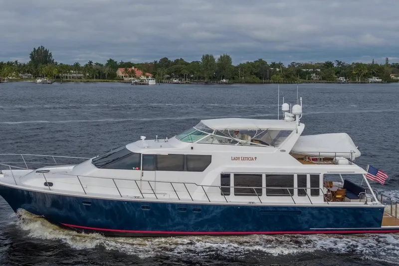 Slide: The Image of 2000 Pacific Mariner 65 Motoryacht cruising on a scenic waterway. - 26