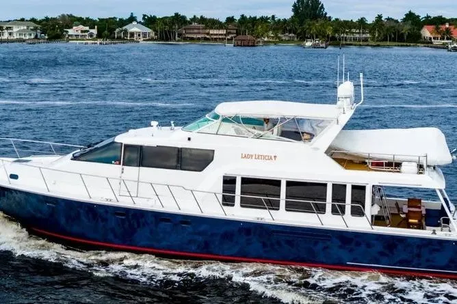 Slide: The Image of 2000 Pacific Mariner 65 Motoryacht cruising on a scenic waterway. - 29