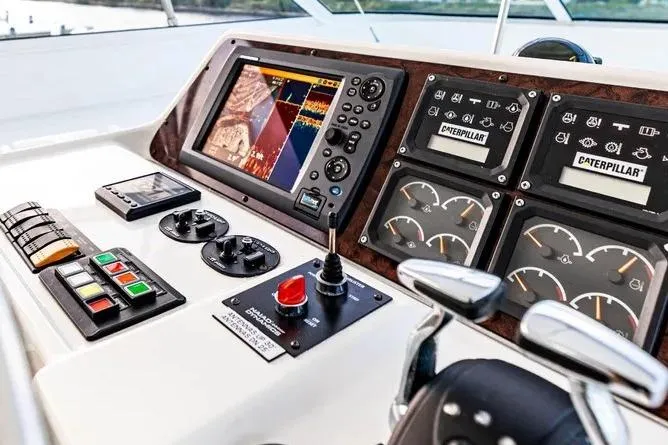 Slide: The Image of Control panel of a 2000 Pacific Mariner 65 Motoryacht with navigation and engine gauges. - 3