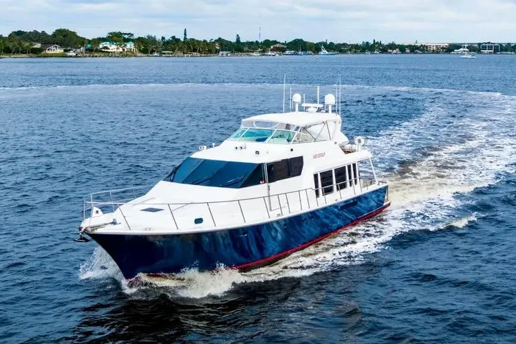 Slide: The Image of 2000 Pacific Mariner 65 Motoryacht cruising on open water, showcasing sleek design and luxury. - 36